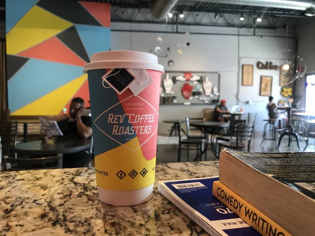 reading and writing at coffee shop