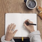 writing on notebook