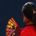 woman holding chinese fan