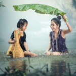 woman and child under rain