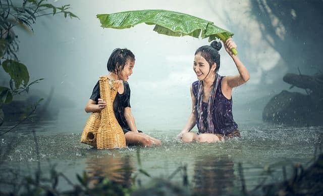 woman and child under rain