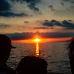 family watching sun set